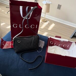 GUCCI GG Emblem small shoulder bag, Black embossed leather